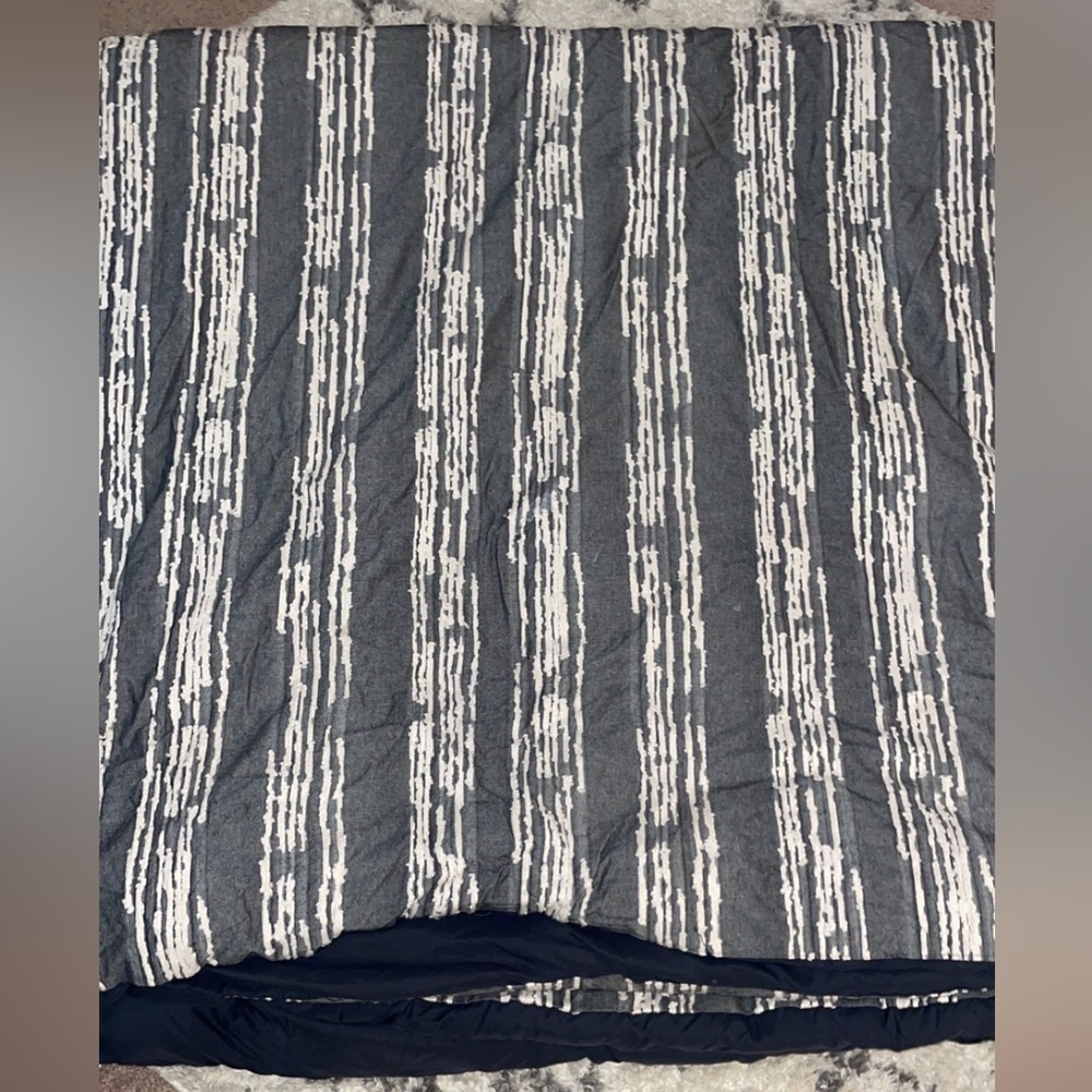 like new gray queen size comforter with pillow cases.